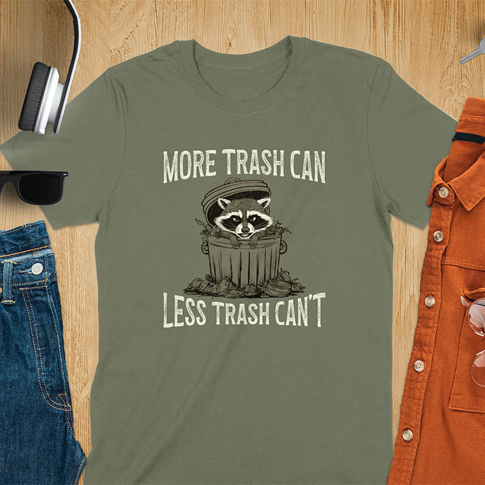 A fun and vintage retro T-Shirt featuring a funny raccoon with the phrase 'More trash can less trash can't'. This T-Shirt exudes a playful and lighthearted vibe, perfect for casual wear or lounging around.