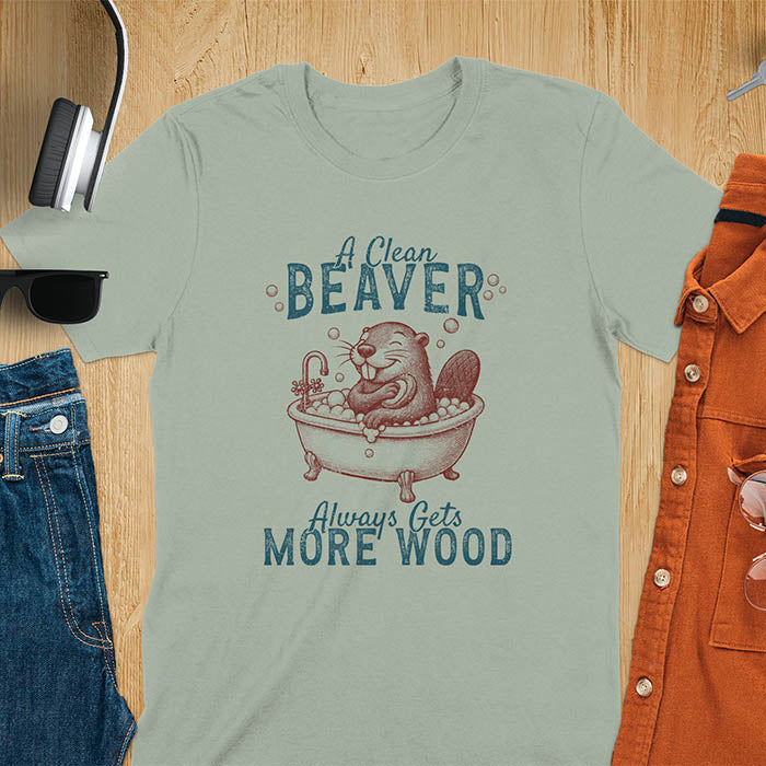 A t-shirt with a cartoon beaver in a bubble bath, holding a scrubber. Text: "A Clean Beaver Always Gets MORE WOOD". This adult humor shirt is a Dark humor shirt, Ironic tee-shirt & Funny meme shirt. A snarky humor designs & funny pun shirts, it's an unhinged meme tshirt for dirty funny adult laughs. An animal person gift, Dark humor tee, mom gift, gift for bff, or Offensive t shirts option.