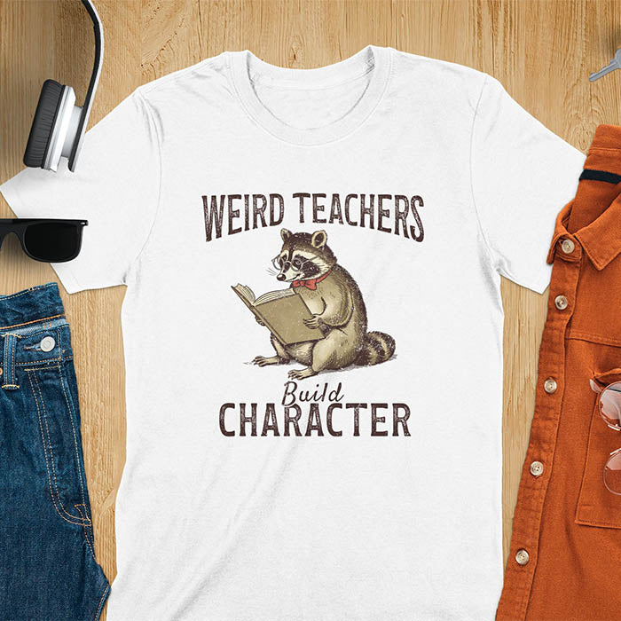 Weird Teachers Build Character shirt featuring a raccoon reading a book with glasses and a red bow tie. Vintage distressed font and brownish monotone give it a retro look. Perfect back-to-school shirt, funny teacher gift, or teacher appreciation tee.