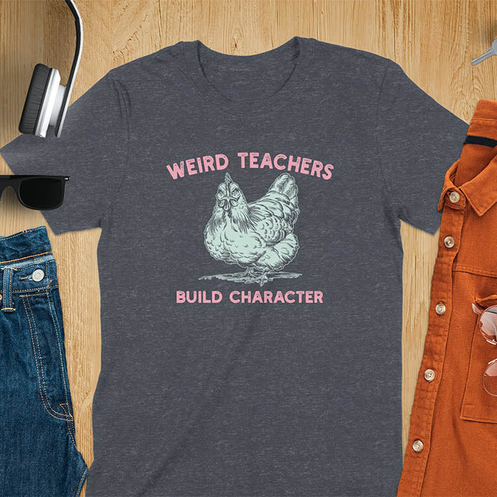 This teacher t-shirt features a grumpy-faced hen. The vintage font with distressed effect says Weird Teachers above the hen and Build Character below, all in a vintage color palette.