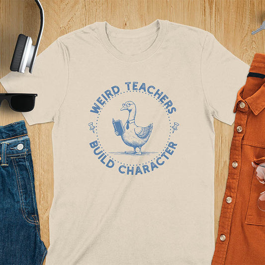 The design features a cartoon goose wearing glasses and holding a book. Surrounding the goose, there is text that reads, WEIRD TEACHERS BUILD CHARACTER.