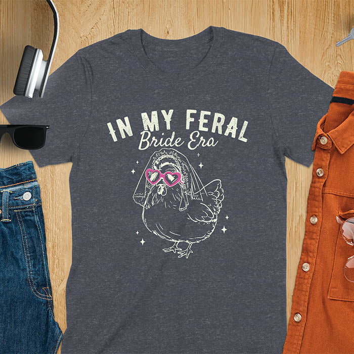 A chicken wearing sunglasses and a bride's veil, with the text "In My Feral Bride Era".