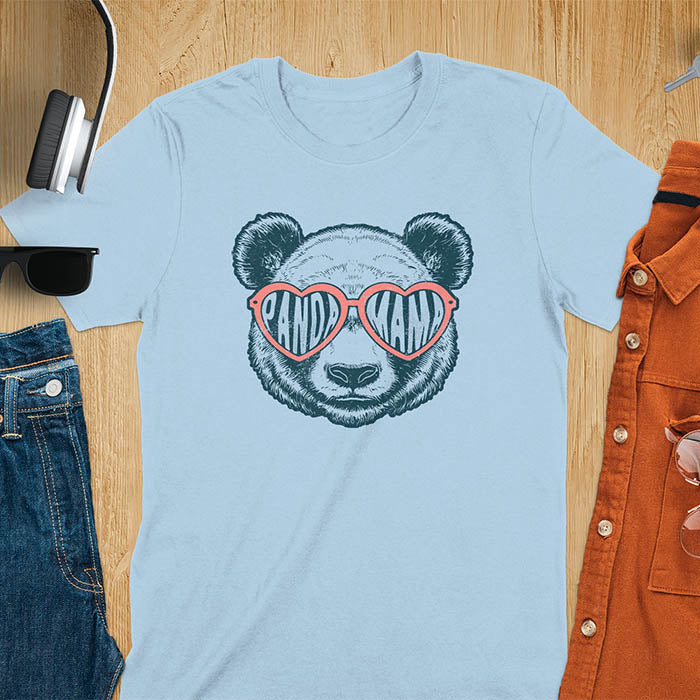A t-shirt featuring a white panda face with pink heart-shaped sunglasses that spell PANDA MAMA. This mama shirt is a vintage mama t-shirt for a funny animal mom. A mom tee for a gift for mom or gift for grandmother. A mom birthday gift or gift for wife, or an expectant mom gift for a pregnancy announce. A great mother days shirt for mama.