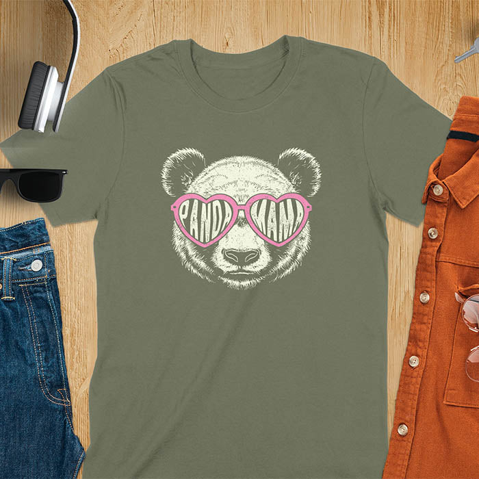 A t-shirt featuring a white panda face with pink heart-shaped sunglasses that spell PANDA MAMA. This mama shirt is a vintage mama t-shirt for a funny animal mom. A mom tee for a gift for mom or gift for grandmother. A mom birthday gift or gift for wife, or an expectant mom gift for a pregnancy announce. A great mother days shirt for mama.