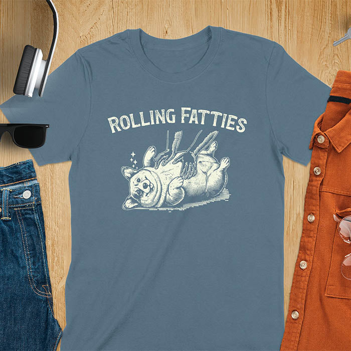 Quirky, trendy t-shirt with funny nostalgia and Y2K doggie pet vet vibes. Features a fat cute corgi and ROLLING FATTIES text. Perfect for corgi dad lovers and mom graphic owners. crewneck outfit with a retro aesthetic.