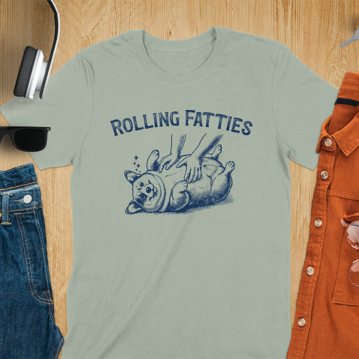 Quirky, trendy t-shirt with funny nostalgia and Y2K doggie pet vet vibes. Features a fat cute corgi and ROLLING FATTIES text. Perfect for corgi dad lovers and mom graphic owners. crewneck outfit with a retro aesthetic.