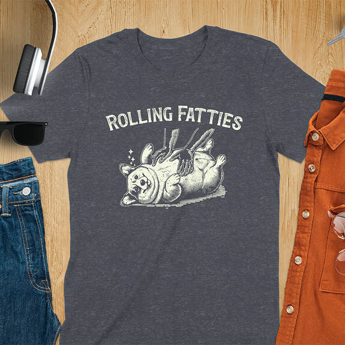 Quirky, trendy t-shirt with funny nostalgia and Y2K doggie pet vet vibes. Features a fat cute corgi and ROLLING FATTIES text. Perfect for corgi dad lovers and mom graphic owners. crewneck outfit with a retro aesthetic.