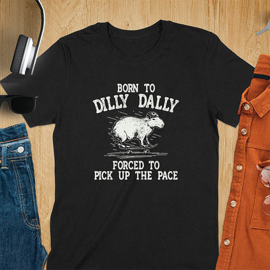 A capybara skateboarding, donning a protective helmet .Above it, the words "Born to dilly dally", while below, "Forced to pick up the pace". Rendered in a charming vintage font with a faded look.