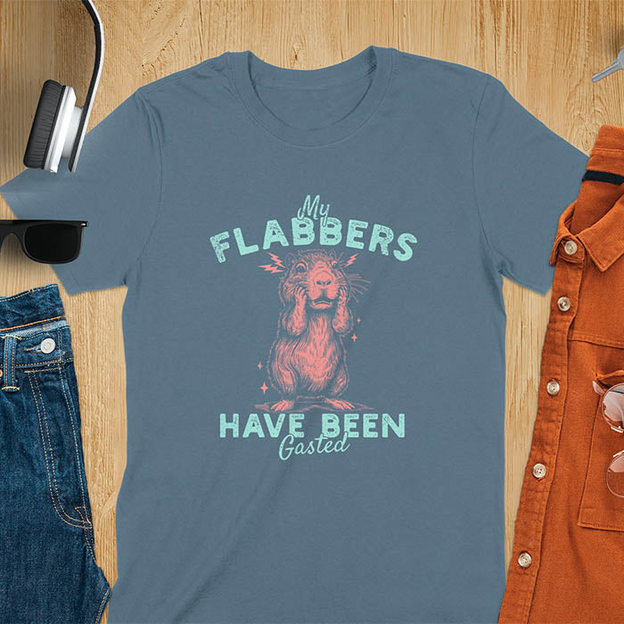 A t-shirt with a startled baby capybara covering its mouth. Text: "My FLABBERS Have Been GASTED". This sarcastic t-shirt is weird silly funny, a Gen Z meme tee & funny gag gift. It has weirdcore memes, vintage retro unhinged tee-shirt appeal & makes shirts that go hard. An animal person gift, animal lover gift, cute animal lover gift, gift mom hers, for kawaiiness cuteness.