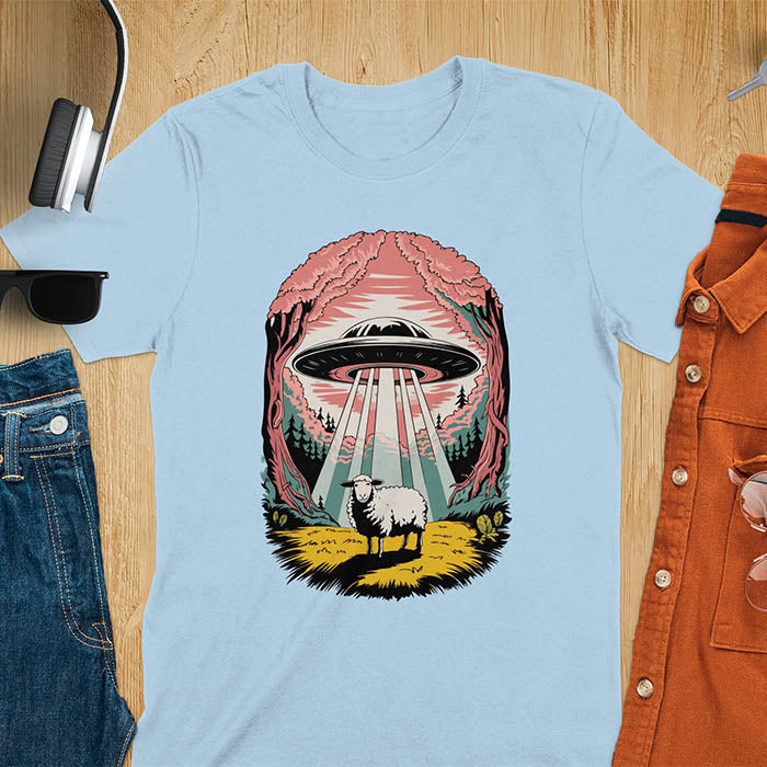 A t-shirt with a UFO hovering over a sheep in a forest scene. This alien tshirt depicts ufo alien abductions with a cute sheep. A weird shirt and funny alien gift, one of those oddly specific tees. A graphic tee-shirt with a 90s graphic tee style. A farm animal gifts or animal person gift. A farmer t shirt or farming shirt, a mom gift alternative.
