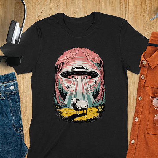 A t-shirt with a UFO hovering over a sheep in a forest scene. This alien tshirt depicts ufo alien abductions with a cute sheep. A weird shirt and funny alien gift, one of those oddly specific tees. A graphic tee-shirt with a 90s graphic tee style. A farm animal gifts or animal person gift. A farmer t shirt or farming shirt, a mom gift alternative.