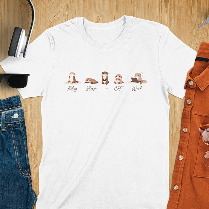 cute funny otters in a row side by side doing daily activities, play, sleep, eat, work, except for one which just stares blankly at you and a ..... is used to describe it. kawaii river otters tee-shirt