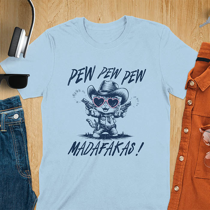 A t-shirt with a cat in a cowboy outfit wearing heart sunglasses and holding two pistols. Text: "PEW PEW PEW" above and "MADAFAKAS!" below. This funny meme t shirt features a funny cowboy cat with a sarcastic quote. A funny genz meme and sarcastic meme shirt, a snarky humorous funny adult joke. An animal person gift or gift for mom, a sassy quote funny funny fuck gift.