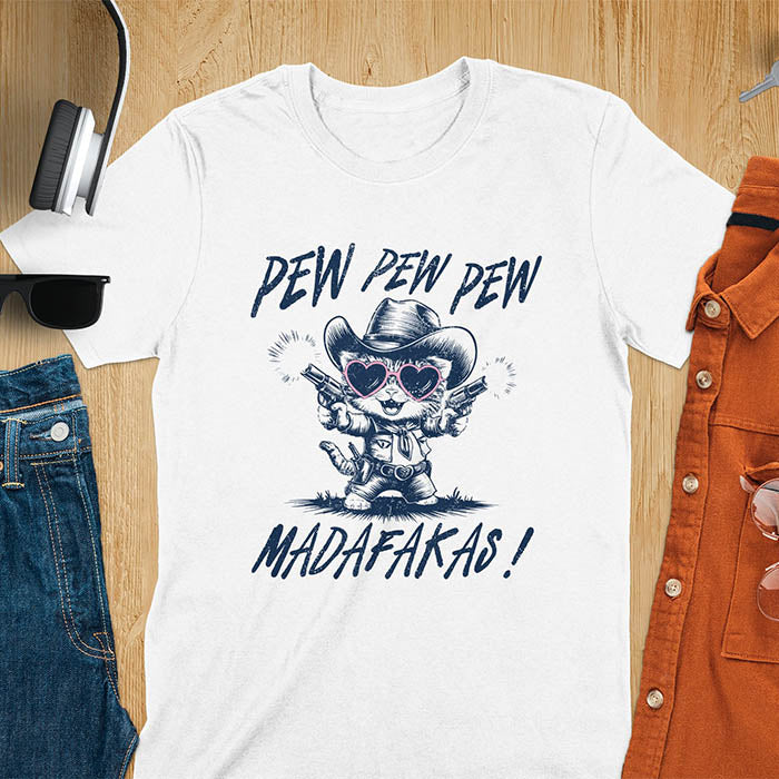 A t-shirt with a cat in a cowboy outfit wearing heart sunglasses and holding two pistols. Text: "PEW PEW PEW" above and "MADAFAKAS!" below. This funny meme t shirt features a funny cowboy cat with a sarcastic quote. A funny genz meme and sarcastic meme shirt, a snarky humorous funny adult joke. An animal person gift or gift for mom, a sassy quote funny funny fuck gift.
