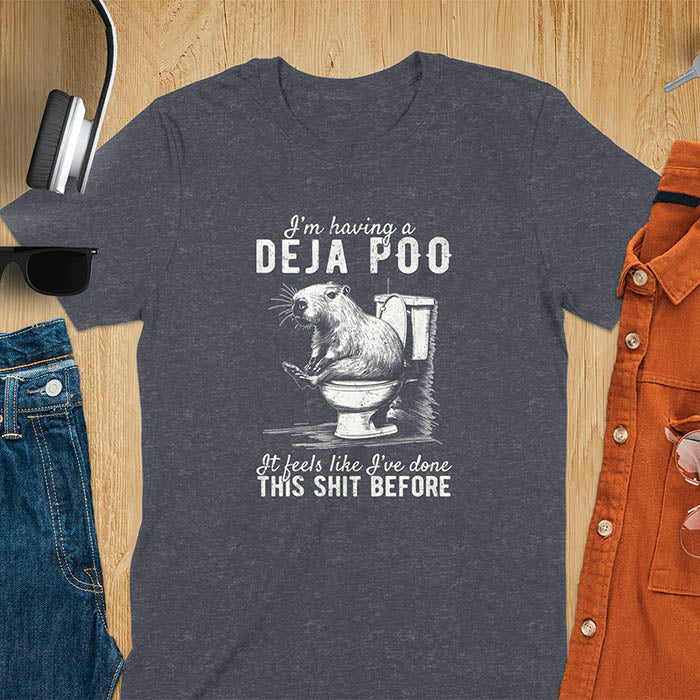 A t-shirt with a capybara seated on a toilet bowl. Text: "I'm having a Deja Poo It feels like I've done THIS SHIT BEFORE". A Capybara Deja Poo Shirt with Toilet Humor Gag Gift appeal. Inappropriate, offensive, weirdcore, funny meme, trending meme, genz gen z tee. Features kawaiiness, capybara cuteness, weird capybara gift. Great for animal person, pet lovers, animal lover, gift mom hers. A Retro Graphic Tshirt, y2k tee-shirt, Vintage Silly Party Tees, shirts that go hard.