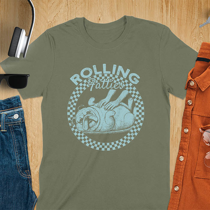 Military green colored unisex t-shirt featuring 'Rolling Fatties' text in blue lettering above a cute chubby bulldog lying on its back within a blue and white checkered circle border