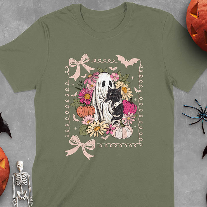 Military Green t-shirt featuring cute ghost holding black cat surrounded by pumpkins, bats, and floral elements in cottagecore coquette style