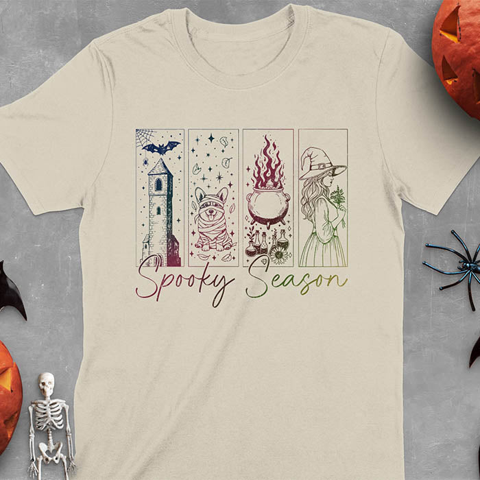 Sand color t-shirt featuring four ombre color panels with haunted house, mummy corgi, bubbling cauldron, and witch figure, with 'Spooky Season' text below