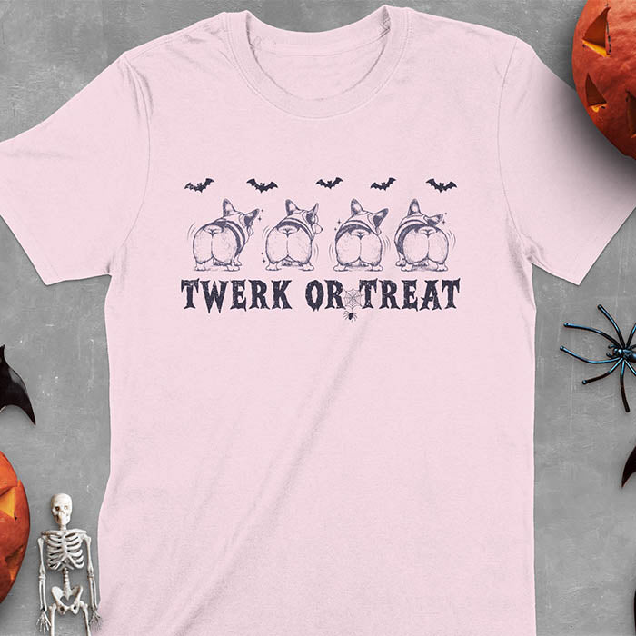 Light Pink t-shirt with Funny Halloween Corgi Twerk or Treat T-Shirt - Four Corgis showing their butts in Halloween theme