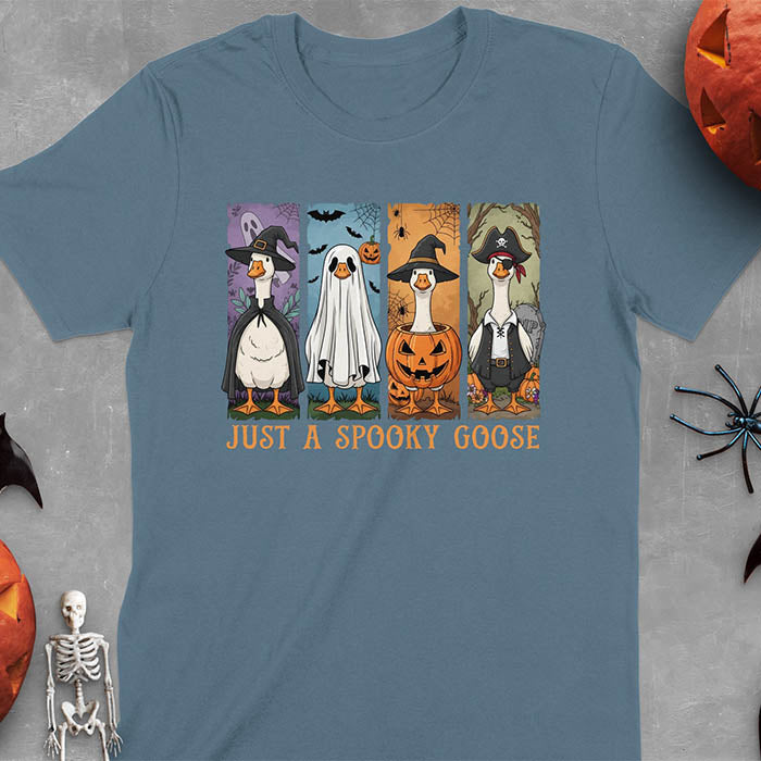 Indigo blue Halloween Just a Spooky Goose t-shirt featuring ghost, pumpkin, witch, and pirate goose designs