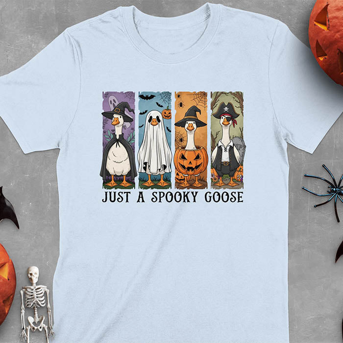 Light blue Halloween Just a Spooky Goose t-shirt featuring ghost, pumpkin, witch, and pirate goose designs