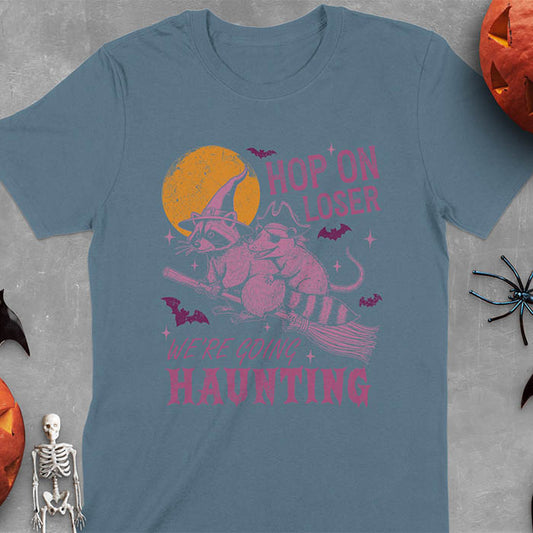 Indigo blue Halloween witch raccoon and opossum t-shirt with flying broom animal graphics