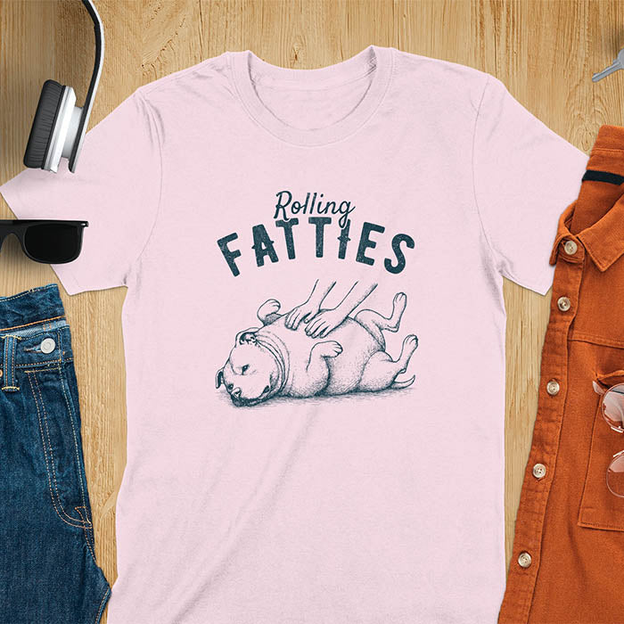 Light Pink t-shirt with 'Rolling Fatties' text and illustration of chubby pitbull dog lying on its back with paws up, with human hands on the dog's belly