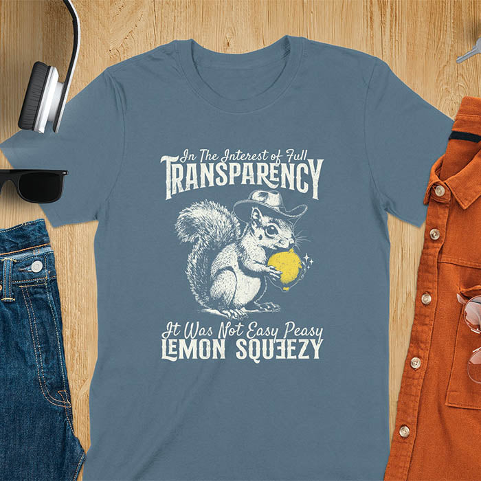 Indigo Blue t-shirt featuring illustrated squirrel wearing cowboy hat and holding yellow lemon with text 'In The Interest of Full Transparency It Was Not Easy Peasy Lemon Squeezy' - funny sarcastic meme design