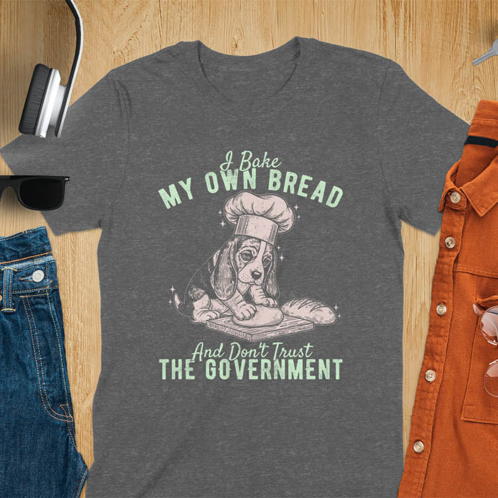 Dark heather Basset Hound chef t-shirt with text 'I Bake MY OWN BREAD And Don't Trust THE GOVERNMENT' featuring basset puppy in chef's hat