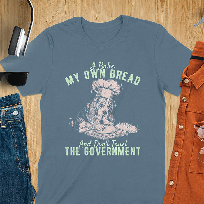 Indigo Blue Basset Hound chef t-shirt with text 'I Bake MY OWN BREAD And Don't Trust THE GOVERNMENT' featuring basset puppy in chef's hat