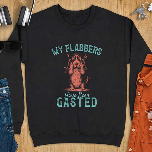 Black sweatshirt with a graphic of a Basset Hound covering its face in shock, lightning bolts crackling by its ears, printed with the text My Flabbers Have Been Gasted.