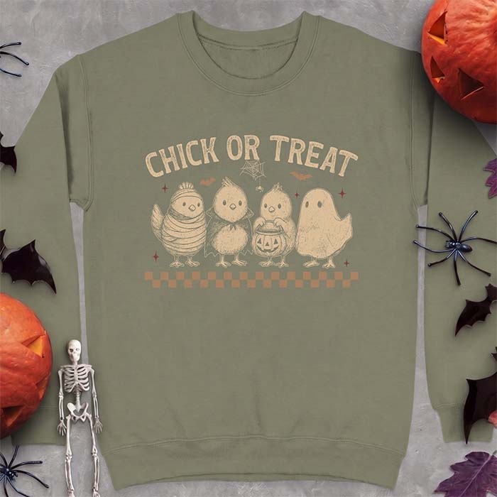 Military Green sweatshirt with a Halloween graphic of four baby chicks dressed as a mummy, a vampire, a pumpkin bucket trick-or-treater and a ghost, with the text Chick Or Treat