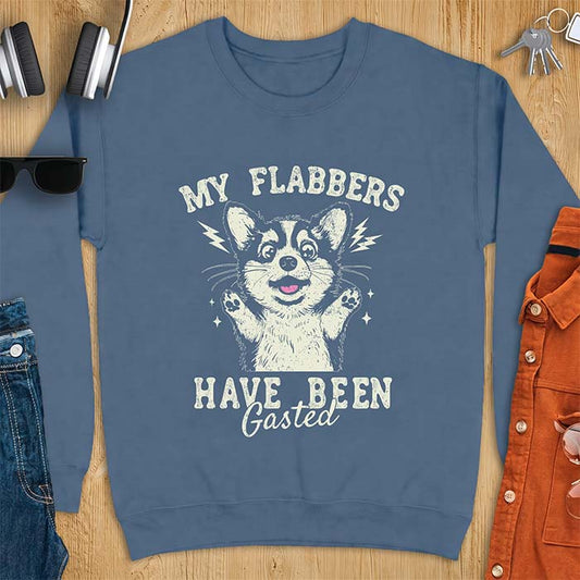 Indigo Blue sweatshirt with a corgi illustration, paws raised in shock, mouth open in a gasp, lightning bolts beside its ears, and the text My Flabbers Have Been Gasted