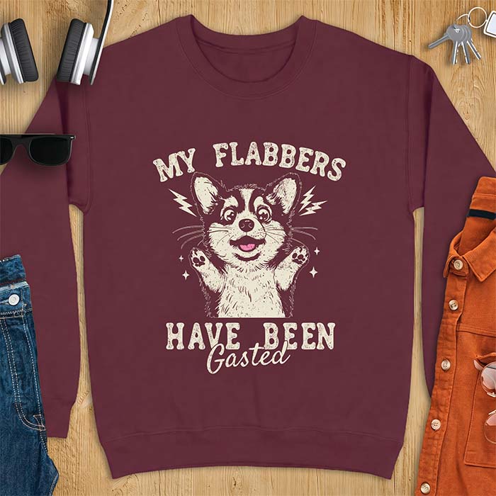 Maroon sweatshirt with a corgi illustration, paws raised in shock, mouth open in a gasp, lightning bolts beside its ears, and the text My Flabbers Have Been Gasted