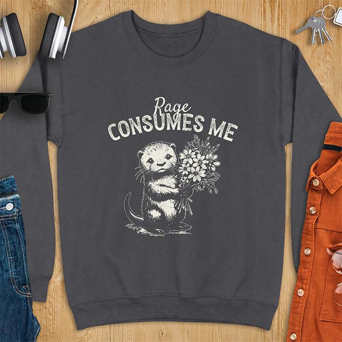 Dark Heather sweatshirt with a graphic of an otter standing upright holding a bouquet of wildflowers and the text Rage Consumes Me