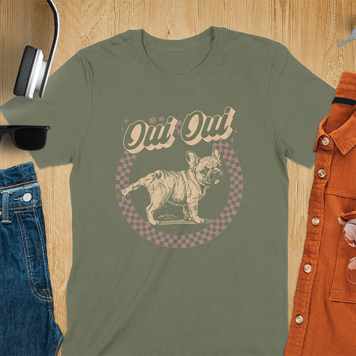 French Bulldog Oui Oui pun t-shirt with checkered circle border and retro script lettering on military green tee