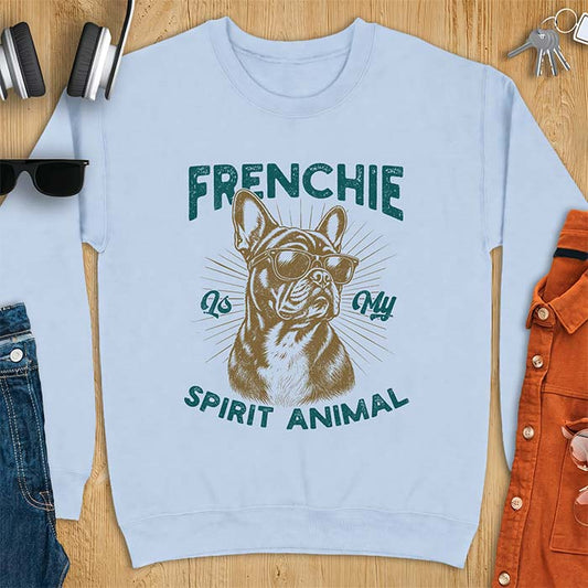 Light Blue sweatshirt featuring a sunglasses-wearing French Bulldog with sunburst rays behind it and the text Frenchie Is My Spirit Animal.