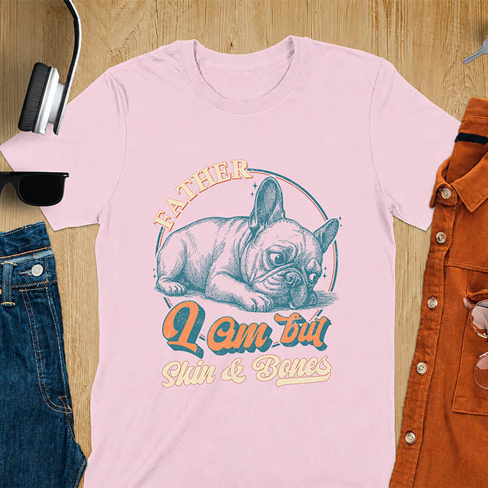 Light pink t-shirt with funny vintage French Bulldog graphic print reading "Father I Am But Skin & Bones" in retro typography
