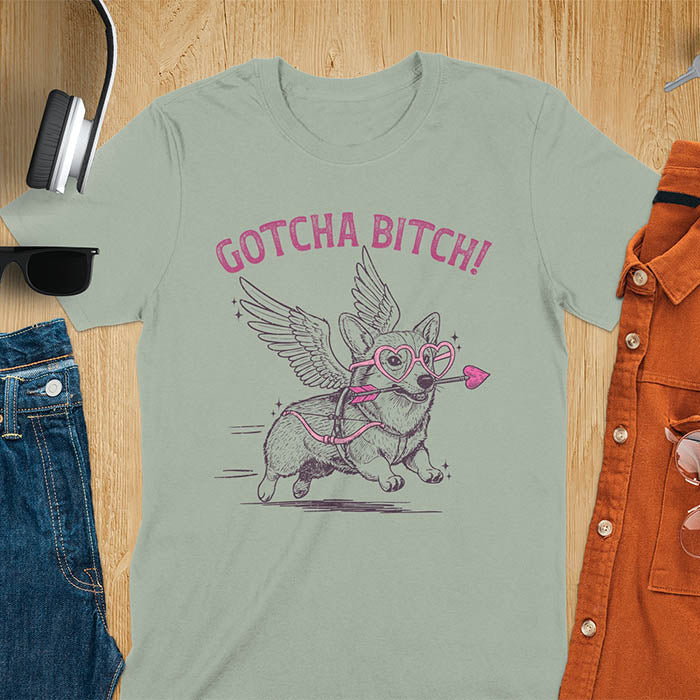 Gotcha Bitch Corgi cupid with angel wings heart glasses and arrow graphic tee on sage green shirt