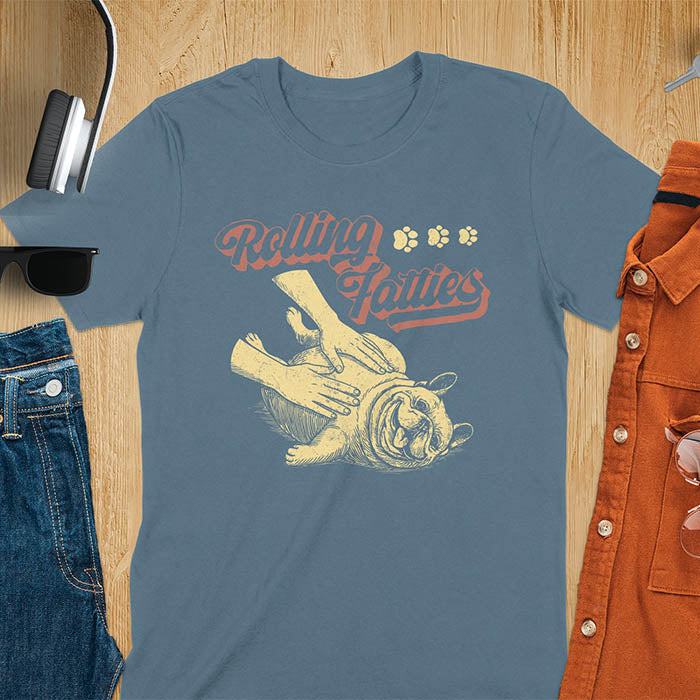 Indigo blue t-shirt with Rolling Fatties script text and French Bulldog being petted by human hands in line drawing style.