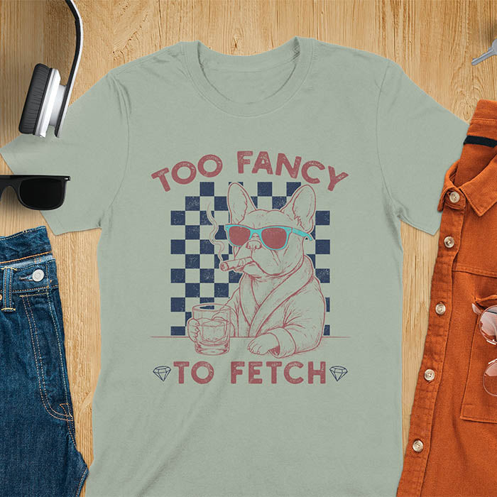 Sage green tee with "Too Fancy To Fetch" text and French Bulldog in sunglasses with whisky and smoking cigar on checkered background