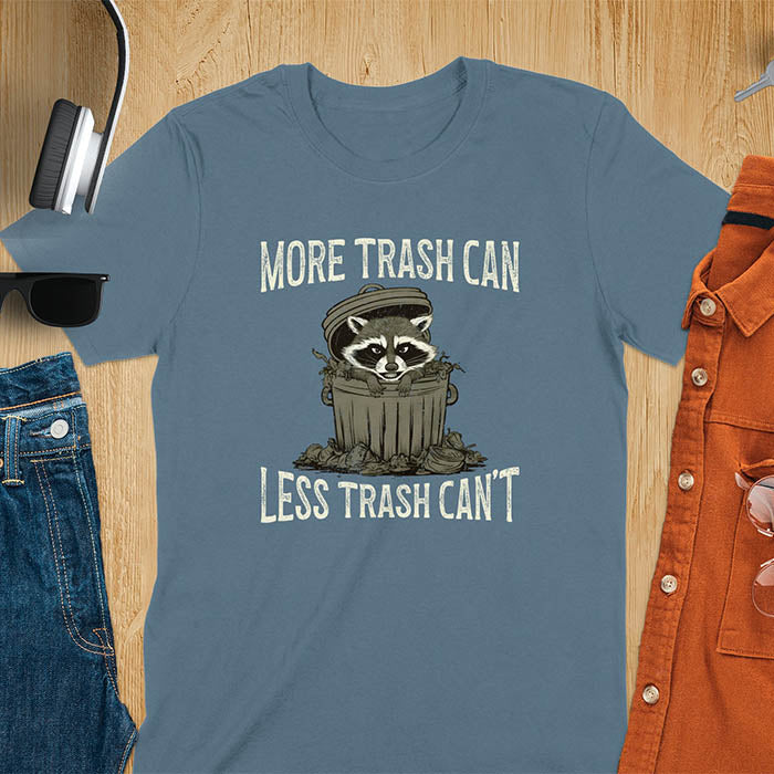 A fun and vintage retro T-Shirt featuring a funny raccoon with the phrase 'More trash can less trash can't'. This T-Shirt exudes a playful and lighthearted vibe, perfect for casual wear or lounging around.