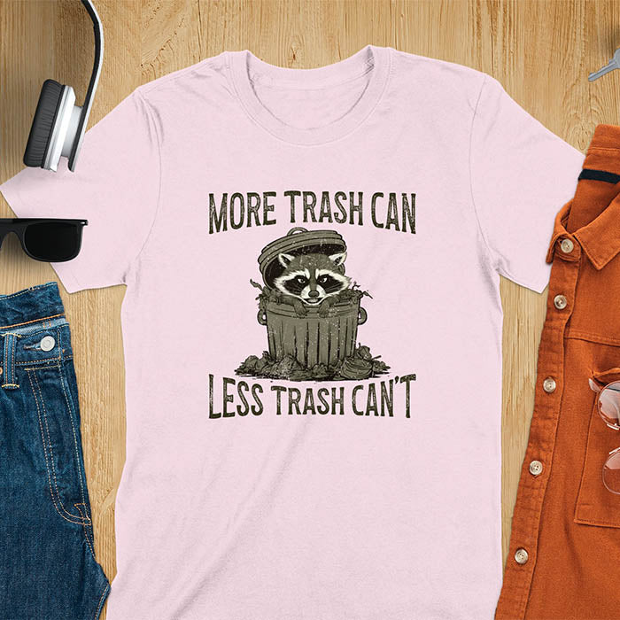 A fun and vintage retro T-Shirt featuring a funny raccoon with the phrase 'More trash can less trash can't'. This T-Shirt exudes a playful and lighthearted vibe, perfect for casual wear or lounging around.
