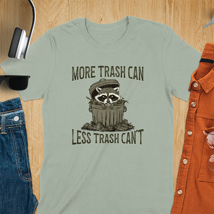 A fun and vintage retro T-Shirt featuring a funny raccoon with the phrase 'More trash can less trash can't'. This T-Shirt exudes a playful and lighthearted vibe, perfect for casual wear or lounging around.