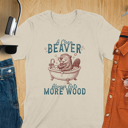 A t-shirt with a cartoon beaver in a bubble bath, holding a scrubber. Text: "A Clean Beaver Always Gets MORE WOOD". This adult humor shirt is a Dark humor shirt, Ironic tee-shirt & Funny meme shirt. A snarky humor designs & funny pun shirts, it's an unhinged meme tshirt for dirty funny adult laughs. An animal person gift, Dark humor tee, mom gift, gift for bff, or Offensive t shirts option.