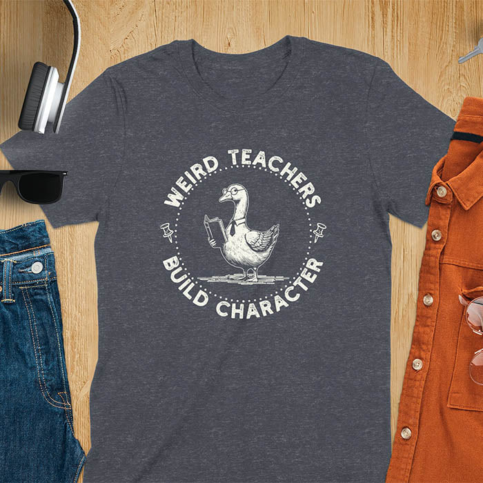 The design features a cartoon goose wearing glasses and holding a book. Surrounding the goose, there is text that reads, WEIRD TEACHERS BUILD CHARACTER.