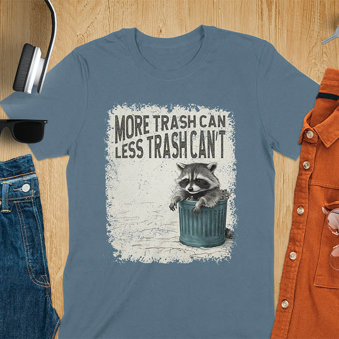 Raccoon lounging on a blue trash can with text "More Trash Can, Less Trash Can't." Distressed texture with vintage font. Perfect for animal lovers, sarcastic shirts, raccoon gifts, and fans of retro funny tees.