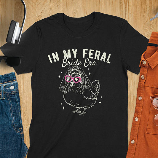 A chicken wearing sunglasses and a bride's veil, with the text "In My Feral Bride Era".