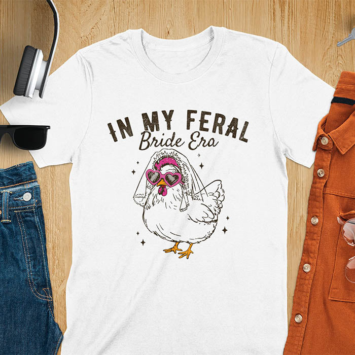 A chicken wearing sunglasses and a bride's veil, with the text "In My Feral Bride Era".