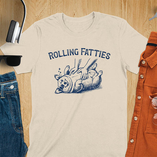 Quirky, trendy t-shirt with funny nostalgia and Y2K doggie pet vet vibes. Features a fat cute corgi and ROLLING FATTIES text. Perfect for corgi dad lovers and mom graphic owners. crewneck outfit with a retro aesthetic.